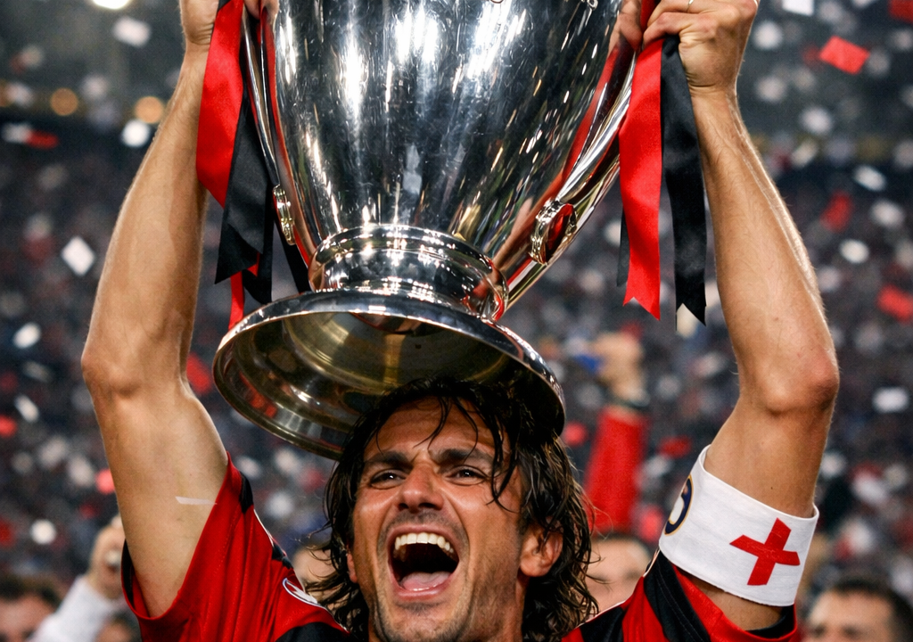 Paolo Maldini celebrating with the Champions League trophy.