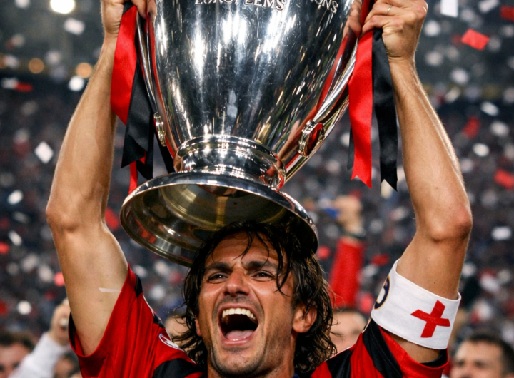 Paolo Maldini celebrating with the Champions League trophy.