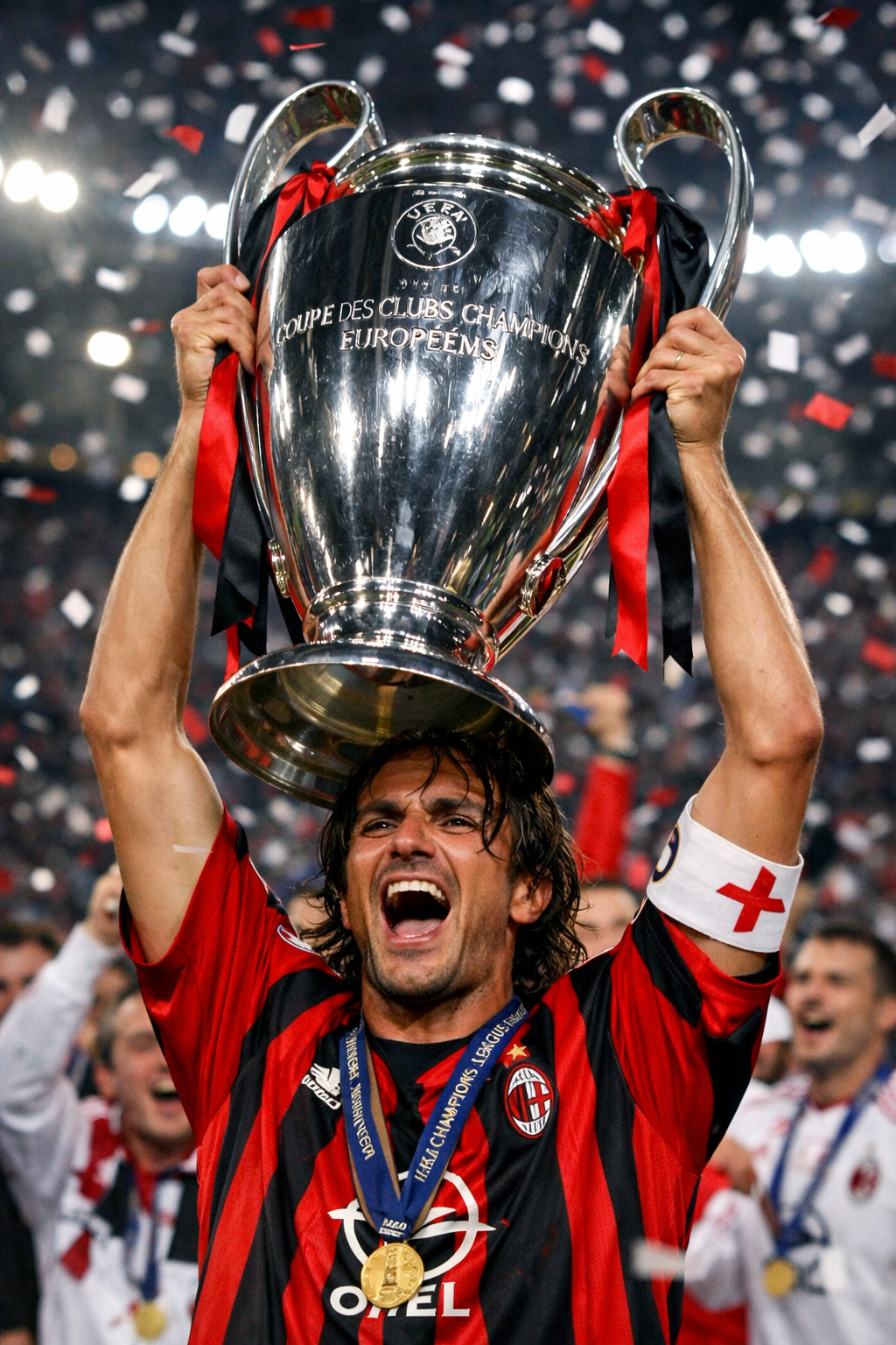 Paolo Maldini celebrating with the Champions League trophy.