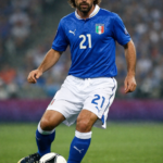 Andrea Pirlo controlling the ball in Italy’s blue jersey during a match